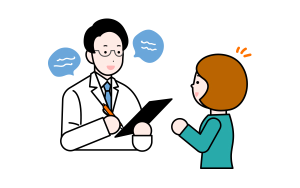 お医者さんが患者さんに問診している